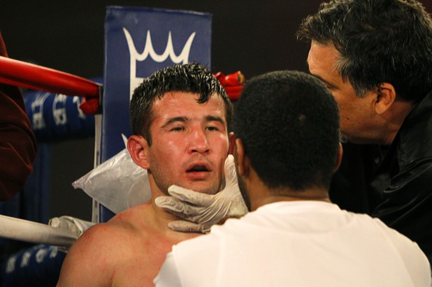 Bahodir "Baha" Mamadjonov of Uzbekistan is treated between rounds during his WBA lightweight bout against Angelo "La Cobra" Santana of Cuba at the Treasure Island Friday, April 12, 2013.