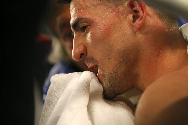 Angelo "La Cobra" Santana of Cuba is treated between rounds during a WBA lightweight bout against Bahodir "Baha" Mamadjonov of Uzbekistan at the Treasure Island Friday, April 12, 2013.