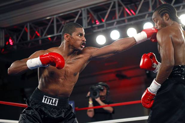 Jeremy "Hollywood" Bryan, left, of Paterson, N.J. connects on Amir "Little Master" Imam of Albany, N.Y. during a super lightweight attraction at the Treasure Island Friday, April 12, 2013. Imam knocked out Bray in the second round.
