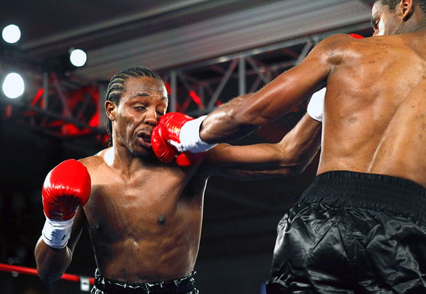 Amir "Little Master" Imam, left, of Albany, N.Y. takes a punch from Jeremy "Hollywood" Bryan of Paterson, N.J. during a super lightweight attraction at the Treasure Island Friday, April 12, 2013. Imam knocked out Bray in the second round.
