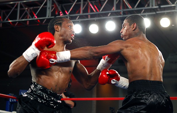 Amir "Little Master" Imam, left, of Albany, N.Y. starts a punch that will knock out Jeremy "Hollywood" Bryan of Paterson, N.J. during the second round of a super lightweight attraction at the Treasure Island Friday, April 12, 2013.