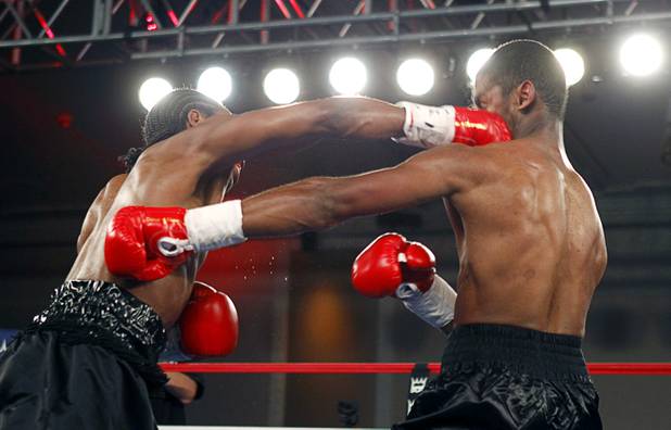Amir "Little Master" Imam, left, of Albany, N.Y. connects with a punch that knocks out Jeremy "Hollywood" Bryan of Paterson, N.J. during the second round of a super lightweight attraction at the Treasure Island Friday, April 12, 2013.