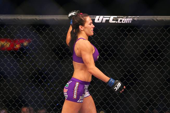 Cat Zingano enters and circles the octagon before her fight against Miesha Tate at The Ultimate Fighter 17 Finale Saturday, April 13, 2013 at the Mandalay Bay Events Center. Zingano won with a third round TKO.