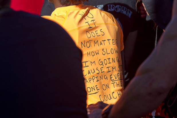 A hand-made message is shown on the back of a T-shirt before the start of the Tough Mudder in Beatty, Nev. Sunday, April 14, 2013. The message reads, "No, it does not matter how slow I'm going because I'm still lapping everyone on the couch." Tough Mudder events are hardcore 10-12 mile obstacle courses designed to test all-around strength, stamina, mental grit, and camaraderie.