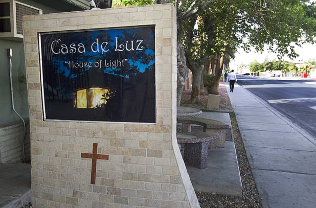A small sign is shown in front of Casa de Luz, a small church on Tam Drive in the Naked City area Monday, April 15, 2013. The church, which currently services about 1,800 area residents with a food pantry, is beginning on a major renovation project.