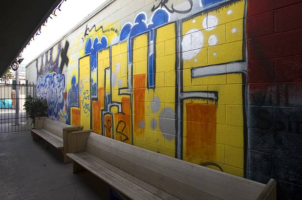 A mural by a local street artist is shown at Casa de Luz, a small church in the Naked City area Monday, April 15, 2013. The church, which currently services about 1,800 area residents with a food pantry, is beginning on a major renovation project.