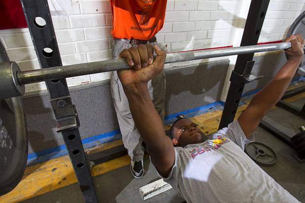 Valley High School football player Noble Hall lifts weights with the team at school weight room Monday, April 15, 2013. Hall recently changed his name from Eric Burrell to Noble Hall (his father's name) to honor his father who was killed before he was born.