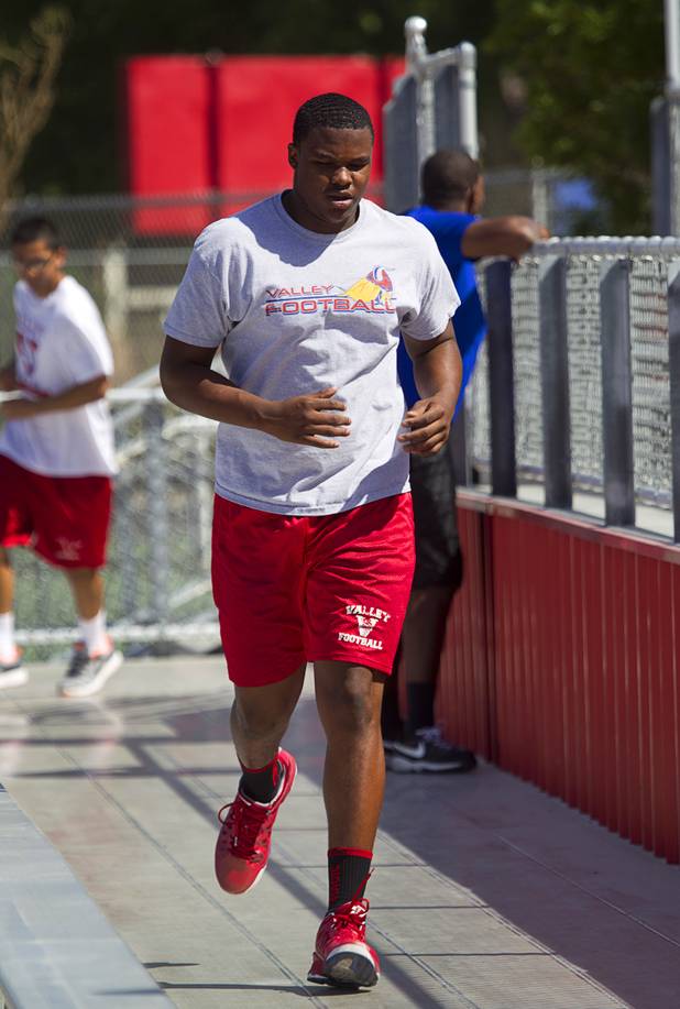 Valley High School football player Noble Hall works out with the team at Valley Monday, April 15, 2013. Hall recently changed his name from Eric Burrell to Noble Hall (his father's name) to honor his father who was killed before he was born.