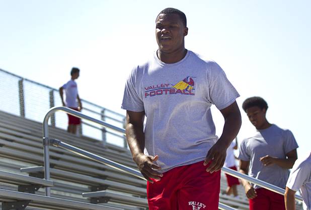 Valley High School football player Noble Hall works out with the team at Valley Monday, April 15, 2013. Hall recently changed his name from Eric Burrell to Noble Hall (his father's name) to honor his father who was killed before he was born.