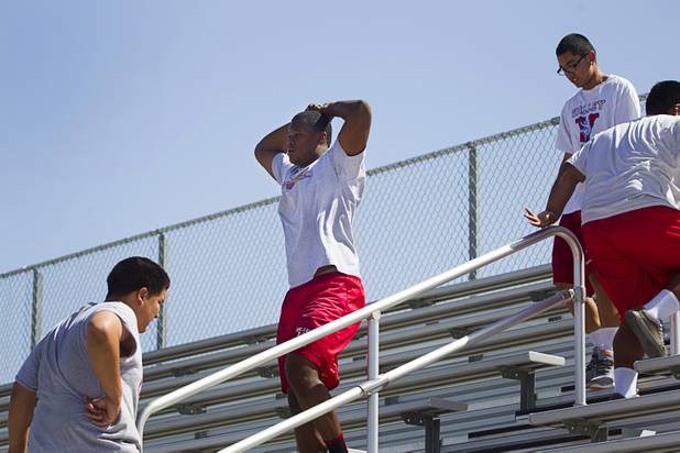 Valley High School football player Noble Hall, center, works out with the team at Valley Monday, April 15, 2013. Hall recently changed his name from Eric Burrell to Noble Hall (his father's name) to honor his father who was killed before he was born.