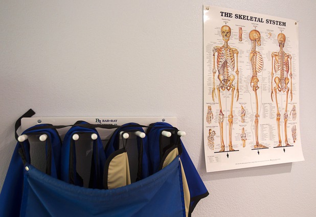A poster in the X-ray room shows the human skeletal system at the Advanced Urgent Care clinic, 9975 S. Eastern Ave., Monday, April 15, 2013.