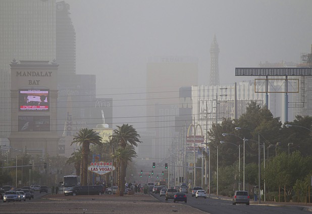 Dust kicked up by high winds obscures the view of Strip casinos Monday, April 15, 2013. 