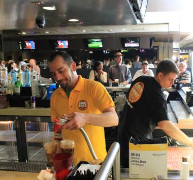 Bartender J.C. Kelley pours a couple of colas about an hour before the doors closed for the final time April 14, 2012, at Gold Spike casino in downtown Las Vegas. The Gold Spike is reopening Monday, May 6, 2012, as a bar and restaurant.