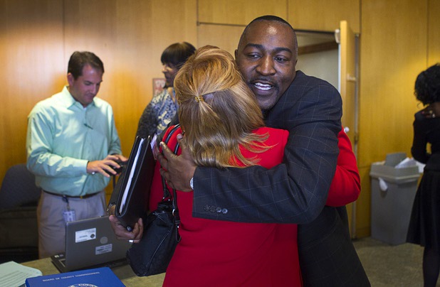 Tyrone Thompson gets a hug from Michelle Jotz after he was appointed to replace expelled Nevada Assemblyman Steven Brooks during a county commission meeting at the Clark County Government Center Tuesday, April 16, 2013. Jotz was also a candidate in the selection process.