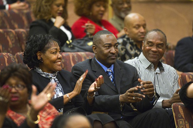 Tyrone Thompson, center, reacts after he was appointed to replace expelled Nevada Assemblyman Steven Brooks during a county commission meeting at the Clark County Government Center Tuesday, April 16, 2013. With Thompson are his aunt Beatrice Soares and his cousin Roosevelt Toston.