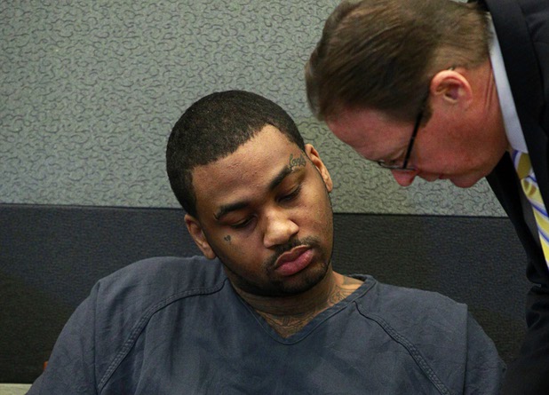 Ammar Harris, the suspect the Feb. 21 Las Vegas Strip shooting and car crash that killed three people, listens to Deputy Special Public Defender David Schieck in court at the Regional Justice Center Wednesday, April  17, 2013.