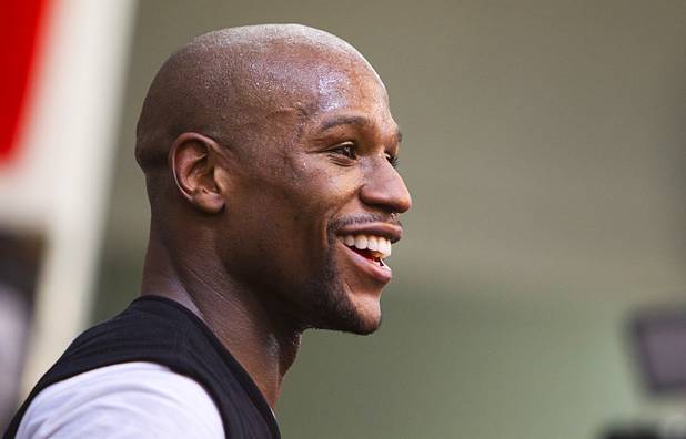 Undefeated welterweight boxer Floyd Mayweather Jr. smiles during a workout at the Mayweather Boxing Club Wednesday, April 17, 2013. Mayweather will defend his WBC welterweight title against Robert Guerrero at the MGM Grand Garden Arena on May 4.