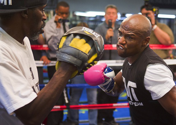 Undefeated welterweight boxer Floyd Mayweather Jr. (R) works on his timing with his uncle and trainer Roger Mayweather at the Mayweather Boxing Club Wednesday, April 17, 2013. Mayweather will defend his WBC welterweight title against Robert Guerrero at the MGM Grand Garden Arena on May 4.