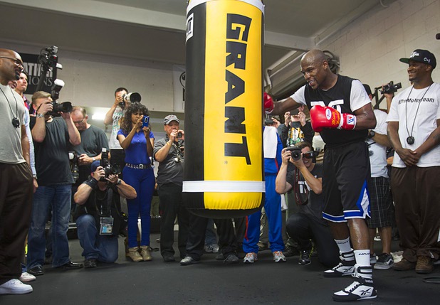 Undefeated welterweight boxer Floyd Mayweather Jr. hits a heavy bag at the Mayweather Boxing Club Wednesday, April 17, 2013. Mayweather will defend his WBC welterweight title against Robert Guerrero at the MGM Grand Garden Arena on May 4.