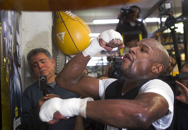 Undefeated welterweight boxer Floyd Mayweather Jr. hits a speedbag at the Mayweather Boxing Club Wednesday, April 17, 2013. Mayweather will defend his WBC welterweight title against Robert Guerrero at the MGM Grand Garden Arena on May 4.
