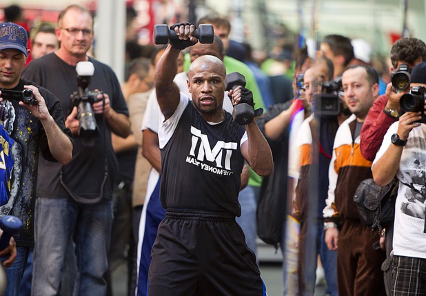 Undefeated welterweight boxer Floyd Mayweather Jr. is shown in a mirror as he works out at the Mayweather Boxing Club Wednesday, April 17, 2013. Mayweather will defend his WBC welterweight title against Robert Guerrero at the MGM Grand Garden Arena on May 4.