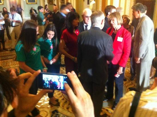 U.S. Sen. Harry Reid meets with gun violence survivors after gun control votes in the U.S. Senate on Wednesday, April 17, 2013.