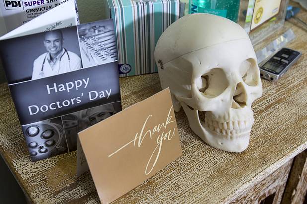 A skull used for teaching medical students is shown on a shelf at the MedLion office, 851 S. Rampart Blvd., Thursday, April 18, 2013. MedLion is a physician group membership plan. For $59 per month, patients get access to a primary care physician. There is no insurance involved.