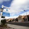 Photo: A realty sign is posted in front of home in the La