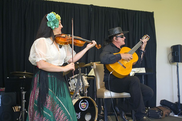 Guitarist Esteban and his daughter Theresa Joy perform during "Animals In Wonderland Champagne & High Tea," an annual fundraiser to support the Nevada SPCA (Society for the Prevention of Cruelty to Animals), at the Spanish Trail Country Club Wednesday, April 25, 2013. The Nevada SPCA, a nonprofit organization, operates a no-kill animal sanctuary in Las Vegas.