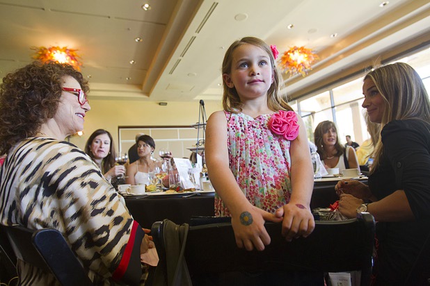 Roma Green, 6, listens to guitarist Esteban and his daughter Theresa Joy as they perform during "Animals In Wonderland Champagne & High Tea," an annual fundraiser to support the Nevada SPCA (Society for the Prevention of Cruelty to Animals), at the Spanish Trail Country Club Wednesday, April 25, 2013. The Nevada SPCA, a nonprofit organization, operates a no-kill animal sanctuary in Las Vegas.
