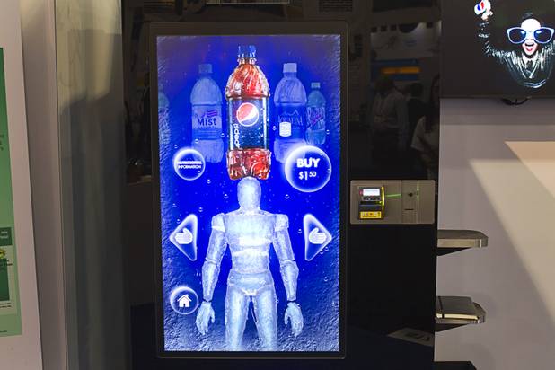 A vending machine equipped with XBox Kinect technology is displayed at a Pepsico booth during the NAMA (National Automatic Merchandising Association) One Show at the Sands Expo Center Wednesday, April 25, 2013. The NAMA One Show convention serves the vending, coffee and food service industries.
