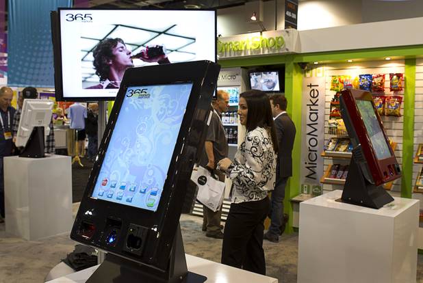 A unmanned micro-market kiosk is displayed at the 365 Retail Markets booth during the NAMA (National Automatic Merchandising Association) One Show at the Sands Expo Center Wednesday, April 25, 2013. The kiosks are becoming popular in corporate break rooms and hospitals, a representative said. The NAMA One show convention serves the vending, coffee and food service industries.