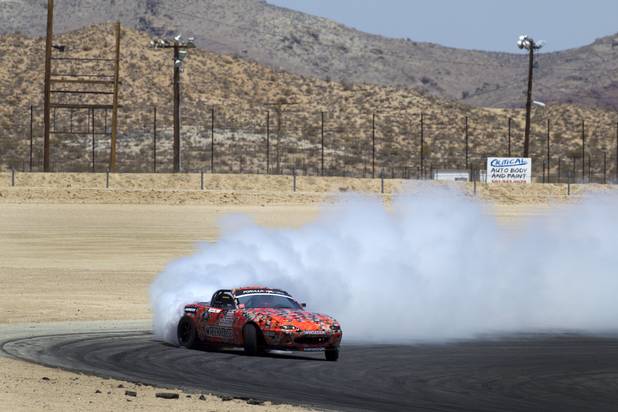 Formula Drift driver Danny George of Las Vegas takes his 1990 WreckHouse Mazda Miata around an oval at the Willow Springs International Raceway near Rosamund, Calif. Sunday, April 28, 2013. George will compete in round two of the 2013 season at Atlanta on May 10-11.