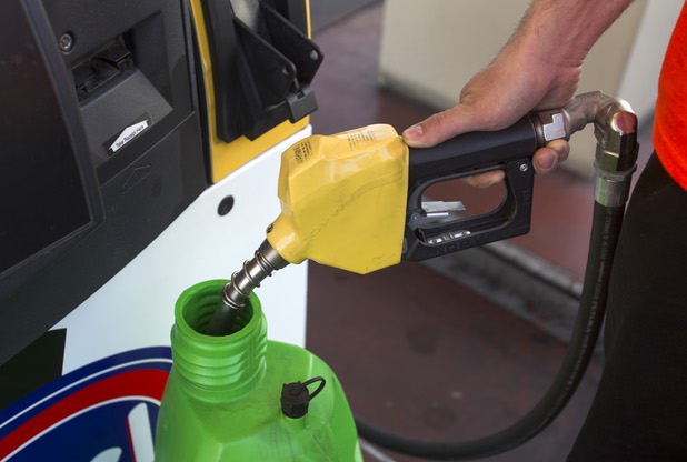 Crew chief Kyle LeBlanc fills a gas can with E85 flex fuel at a Rebel Station before heading to the Willow Springs International Raceway near Rosamund, Calif. with Formula Drift driver Danny George Sunday, April 28, 2013. The highly effective octane rating makes E85 a cheap substitute for racing fuel.