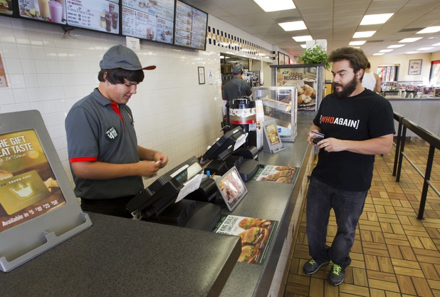 Formula Drift driver Danny George of Las Vegas stops for breakfast at a Burger King at Barstow on the way to the Willow Springs International Raceway near Rosamund, Calif. Sunday, April 28, 2013. Life on the road means lots of fast food for the Wreckhouse crew.
