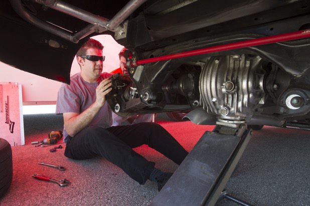Crew chief Kyle LeBlanc works on the 1990 WreckHouse Mazda Miata before testing at the Willow Springs International Raceway near Rosamund, Calif. Sunday, April 28, 2013. Formula Drift driver Danny George of Las Vegas  will compete in round two of the 2013 season at Atlanta on May 10-11.
