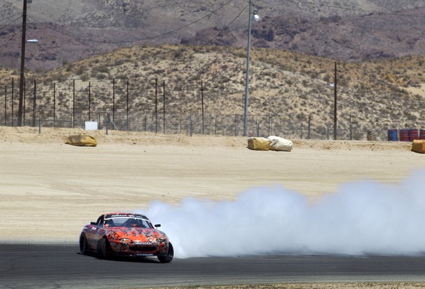 Formula Drift driver Danny George of Las Vegas slides around a turn in the 1990 WreckHouse Mazda Miata at the Willow Springs International Raceway near Rosamund, Calif. Sunday, April 28, 2013. George will compete in round two of the 2013 season at Atlanta on May 10-11.