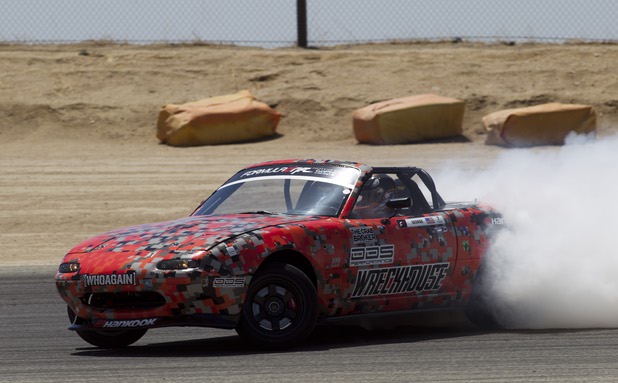 Formula Drift driver Danny George of Las Vegas slides the 1990 WreckHouse Mazda Miata during testing at the Willow Springs International Raceway near Rosamund, Calif. Sunday, April 28, 2013. George will compete in round two of the 2013 season at Atlanta on May 10-11.