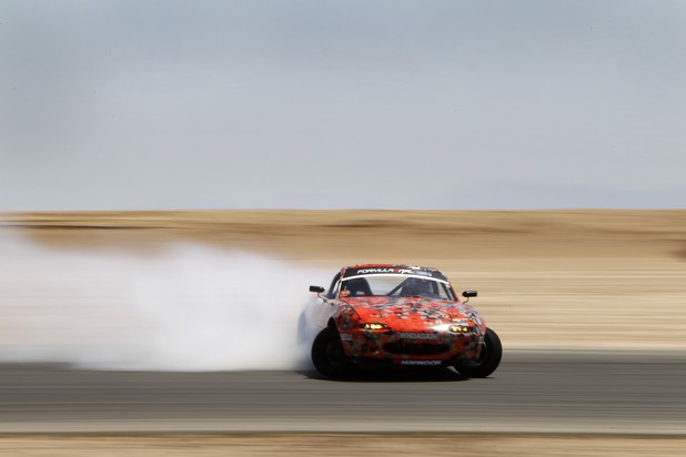 Formula Drift driver Danny George of Las Vegas slides the 1990 WreckHouse Mazda Miata during testing at the Willow Springs International Raceway near Rosamund, Calif. Sunday, April 28, 2013. George will compete in round two of the 2013 season at Atlanta on May 10-11.