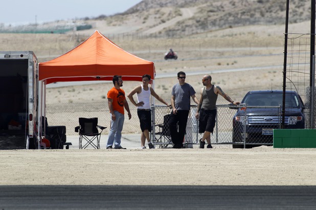 Crew members, from left, Julian Lucas, Steven Heck, Kyle LeBlanc, and George Kiriakopoulos, wait for Formula Drift driver Danny George of Las Vegas to make a run with the 1990 WreckHouse Mazda Miata at the Willow Springs International Raceway near Rosamund, Calif. Sunday, April 28, 2013. George will compete in round two of the 2013 season at Atlanta on May 10-11.