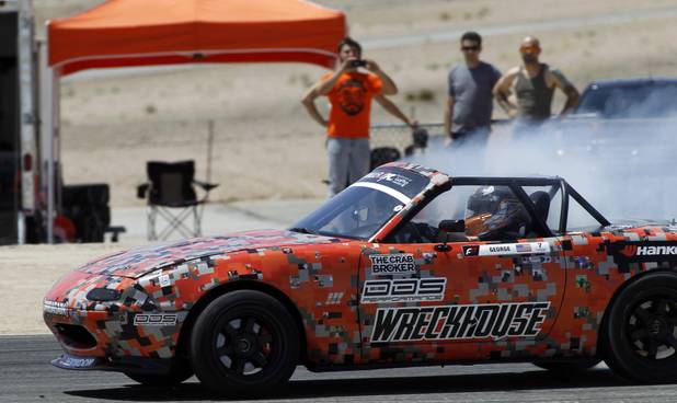 Formula Drift driver Danny George of Las Vegas slides the 1990 WreckHouse Mazda Miata during testing at the Willow Springs International Raceway near Rosamund, Calif. Sunday, April 28, 2013. George will compete in round two of the 2013 season at Atlanta on May 10-11.