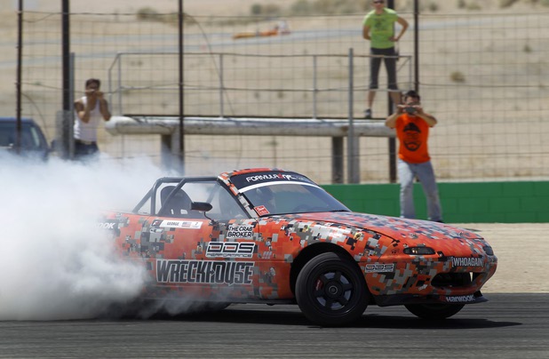Formula Drift driver Danny George of Las Vegas slides the 1990 WreckHouse Mazda Miata during testing at the Willow Springs International Raceway near Rosamund, Calif. Sunday, April 28, 2013. George will compete in round two of the 2013 season at Atlanta on May 10-11.