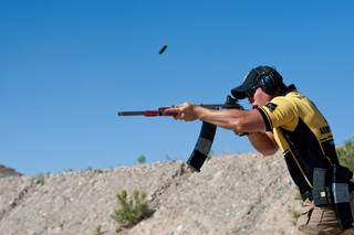 Sgt. Shane Coney, U.S. Army Marksmanship Unit, using his customized Russian-made 12-gauge shotgun competes in the 2013 United States Practical Shooting Association Multi-gun National Championship at Desert Sportsmen in Las Vegas, Sunday, April 28, 2013.