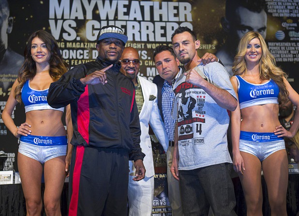 Undefeated WBC welterweight champion Floyd Mayweather Jr., left, poses with Robert Guerrero, also , during a news conference at the MGM Grand Wednesday, May 1, 2013. Mayweather will defend his title against Guerrero at the MGM Grand Garden Arena on Saturday. In the background are Leonard Ellerbe, CEO of Mayweather Promotions, and Oscar De La Hoya of Golden Boy Promotions.