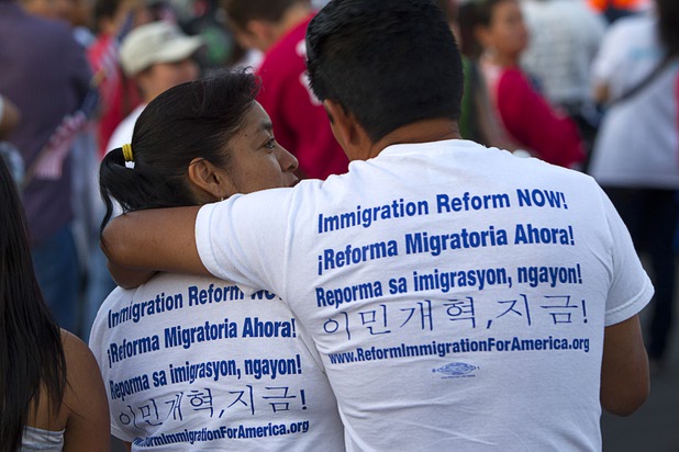 A couple wears shirts calling for immigration reform in different languages during a May Day rally and march for comprehensive immigration reform at the  Wednesday, May 1, 2013. The event started at the George Federal Building downtown, then marchers traveled south on Las Vegas Boulevard, finishing with a rally at St. Louis Square near the Stratosphere.