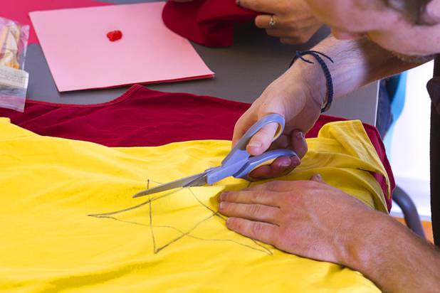 Taylor Johns works on a prom costume at the Center Wednesday, May 1, 2013. "Gaymer," the 2013 LGBTQ youth prom, is scheduled for Saturday, May 4. The dress is video game-themed costumes or prom attire. Johns' costume will be "Diddy Kong," a character in the Donkey Kong video games, he said.