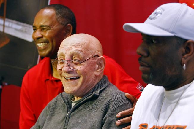 Coach Jerry Tarkanian and former players Robert Smith, left, and Eldridge Hudson, pose for photos during the announcement of the creation of The Jerry Tarkanian Legacy Project, which includes a statue of Tarkanian and his ubiquitous towel,  Wednesday, May 1, 2013.