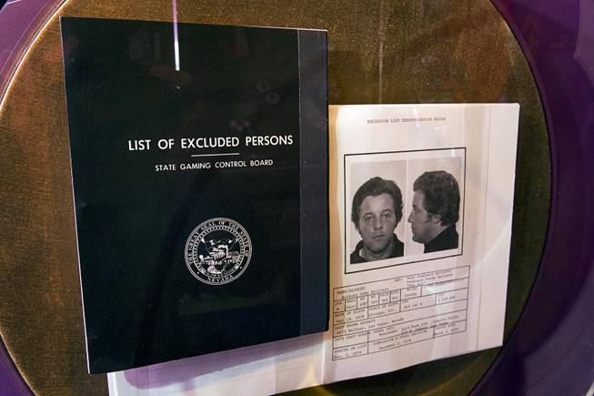 A Black Book, a State Gaming Control Board list of people excluded from Nevada casinos, is displayed at the Mob Museum in downtown Las Vegas Monday, Feb. 13, 2012. At right is a page on former mobster Tony "The Ant" Spilotro, who was removed from the book only after his death.
