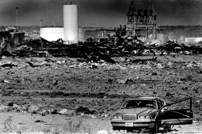 A car lies amid the rubble May 6, 1988, after two large explosions destroyed the Pacific Engineering Production Company of Nevada plant in Henderson on May 4, 1988. Debris rained down around the city, and the windows and doors of nearby homes were shattered by the incident. 
