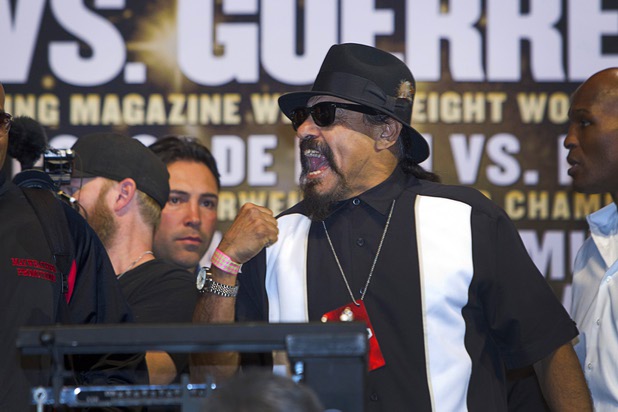 Ruben Guerrero, father of welterweight boxer Robert Guerrero, celebrates after his son makes weight during an official weigh-in at the MGM Grand Garden Arena Friday, May 3, 2013. Robert Guerrero will challenge undefeated WBC welterweight champion Floyd Mayweather Jr. for the title at the arena on Saturday.